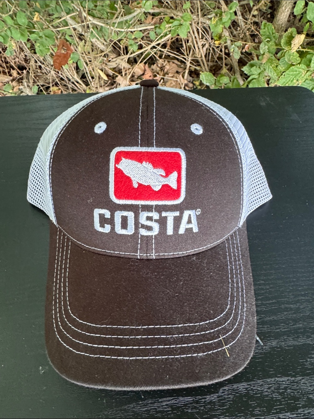 Costa Brown and White Trucker Hat with Red Logo